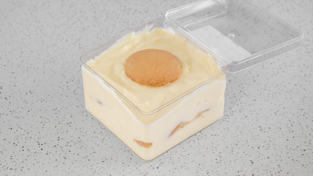 Infusion Lab Banana Pudding with banana, vanilla pudding, and vanilla wafers in a clear dessert pot.
